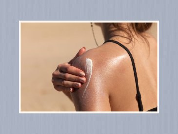 Teen girl applying sunscreen