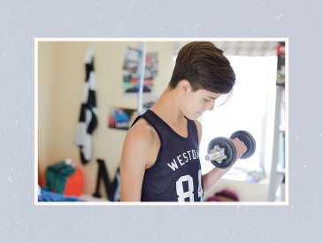 Teen working out with dumbbells